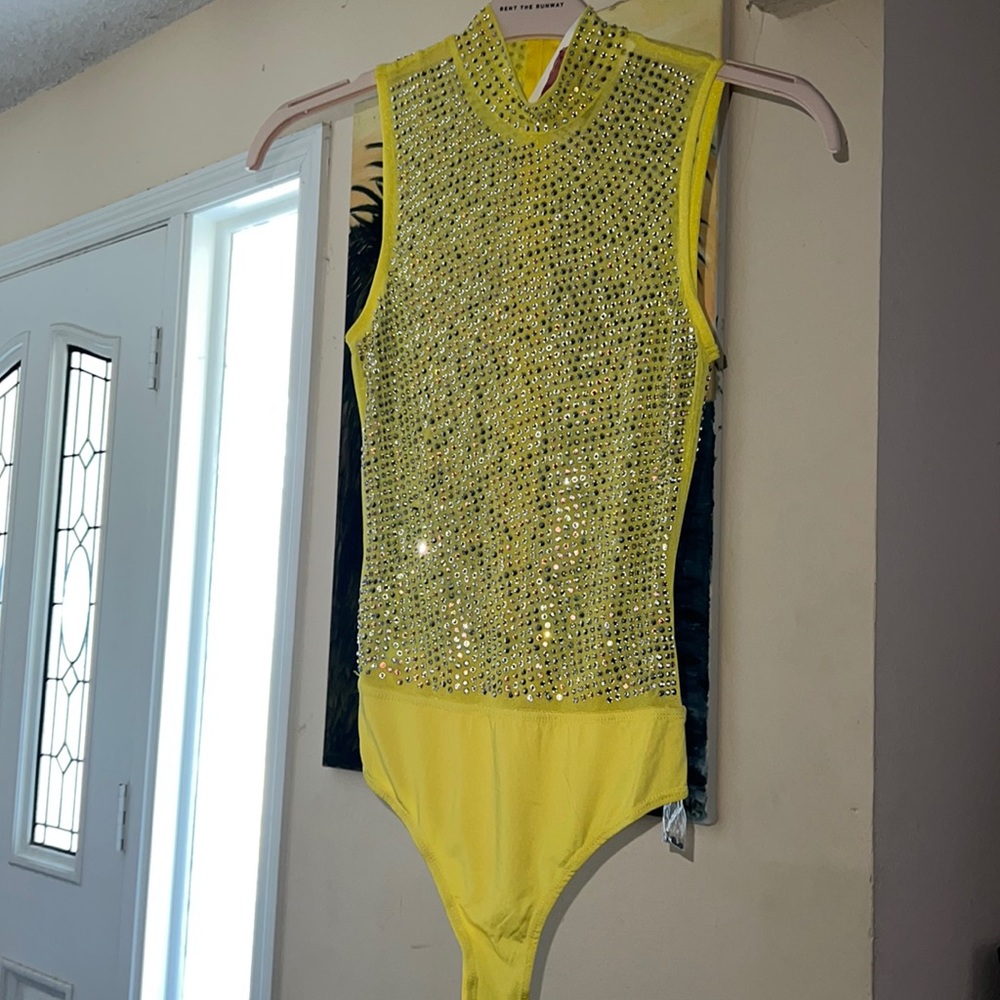 Baby Crystal, yellow embellished body suit size small with extra stones.